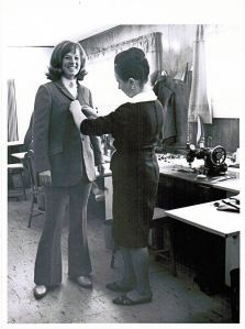 Elfriede making final adjustments to Diane's suit (one of two created for each of the ladies)